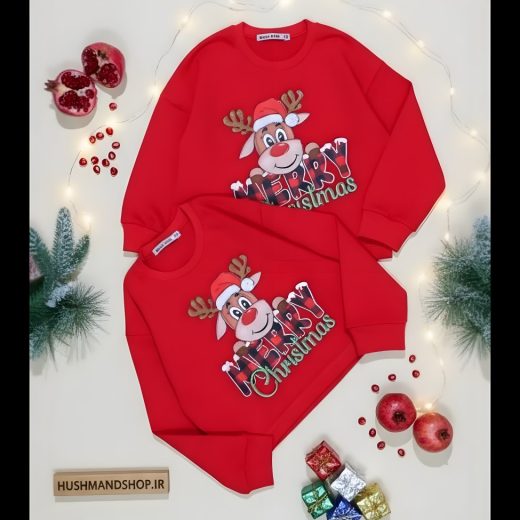 سویشرت قرمز بچگانه طرح گوزن و نوشته Merry Christmas با چیدمان یلدایی انار و تزیینات کاج کریسمس